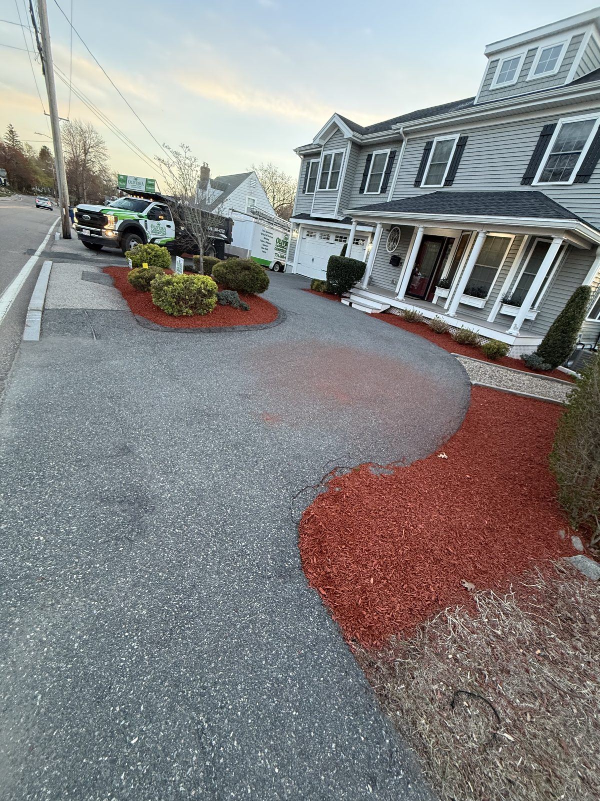 Dramatic red-mulch curb-appeal transformation by Oliveira Landscaping